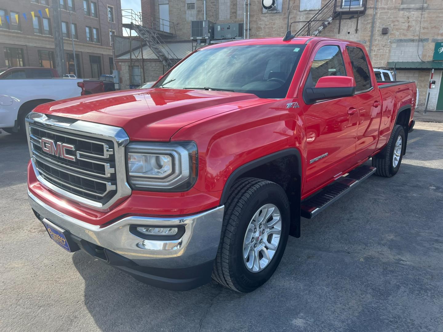 2019 Red /Charcoal GMC Sierra 1500 SLE (2GTV2MEC9K1) with an 5.3L V8 engine, Automatic transmission, located at 116 5th Avenue South, Lewistown, MT, 59457, 47.063877, -109.427879 - Discover the rugged versatility of the 2019 GMC Sierra 1500 SLE Double Cab 4WD. This truck is built to handle tough tasks with ease, whether you're tackling a worksite or heading off-road for adventure. Equipped with a powerful 5.3L V8 engine and advanced 4WD system, the Sierra 1500 SLE delivers im - Photo#6